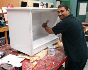 After the first success, a student paints a second console.
